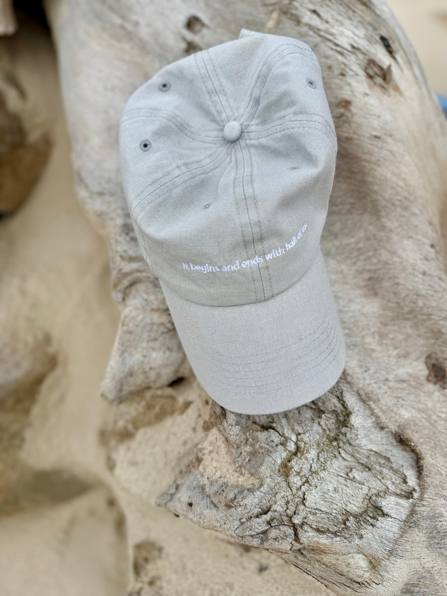 'it begins and ends with half of us' cap